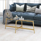 Table basse ovale en verre trempé – Laiton / Bronze noirci, pieds fuselés, pour 2 à 4 personnes